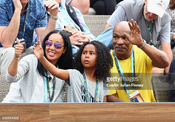 Mike Tyson, Kiki Tyson and Milan Tyson watch Serena Williams of USA play during day seven of the BNP Paribas Open at Indian Wells Tennis Garden on...