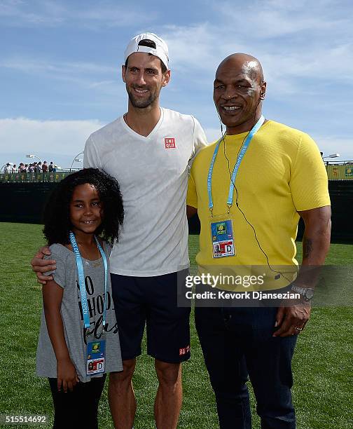 Novak Djokovic of Serbia meets Mike Tyson and daughter Milan Tyson during day seven of the BNP Paribas Open at Indian Wells Tennis Garden on March...