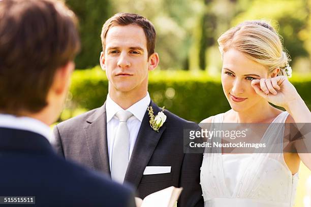 beautiful bride crying during wedding ceremony - sad groom stock pictures, royalty-free photos & images