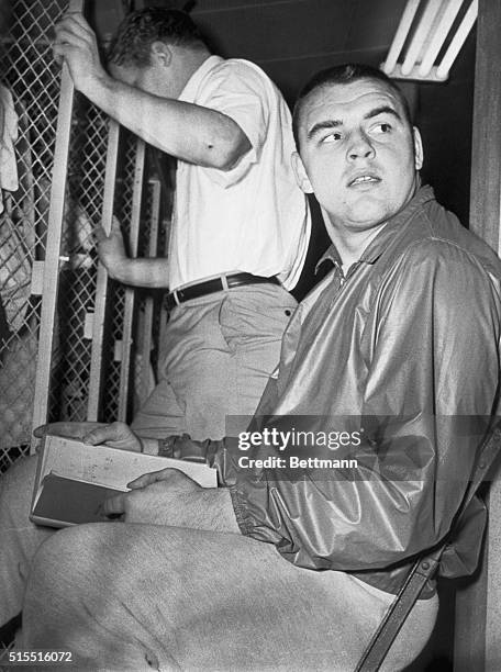 Chicago Bears rookie linebacker Dick Butkus looks up from a play book that he is studying here 12/8 in preparation for an all important NFL game...