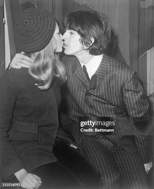 London: Big embrace from George Harrison for his bride, the former Patti Boyd. Note that both Patti and George wear trousers; maybe the start of...