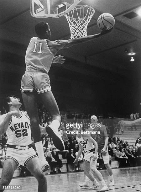 William Cager , reserve player for Western, scores two or more against University of Nevada varsity while Jeff Hart watches below, in last two...