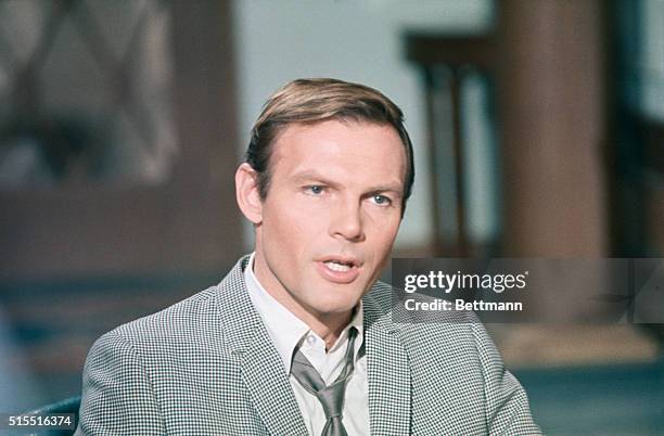 Closeup of Adam West, who plays Batman in the TV series, in civilian dress.