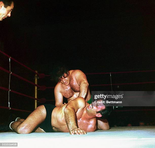 Strong-boy Bruno Sammasrtino, of Abruzzi, Italy, downs Michele Scicluma, of Malta, during their match at Madison square garden here January 24....