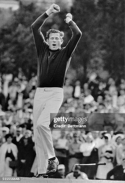 Veteran Doug Sanders drops his putter, and leaps and yells for joy after sinking a five-foot putt on the second hole of a sudden death play off with...