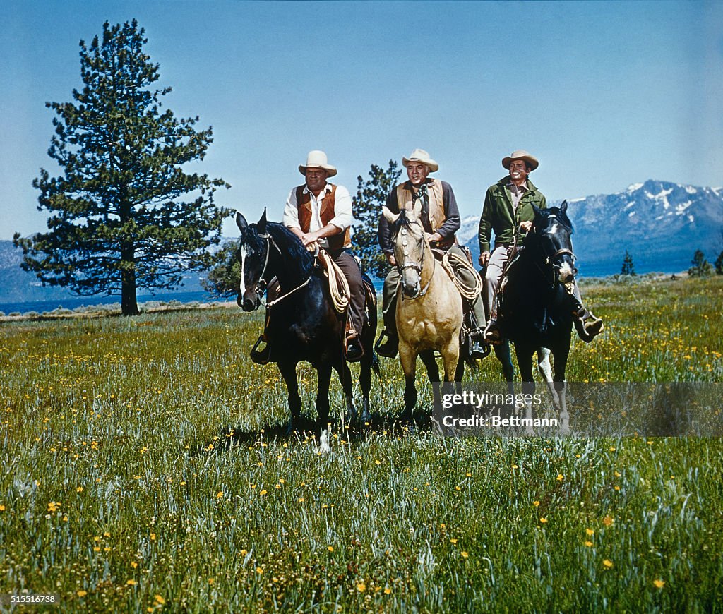 Stars of Bonanza Sitting on Horses in Open Field