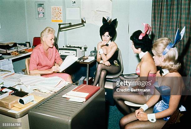 At the Chicago Playboy Club, the Bunny Mother talks with some of the bunnies, .