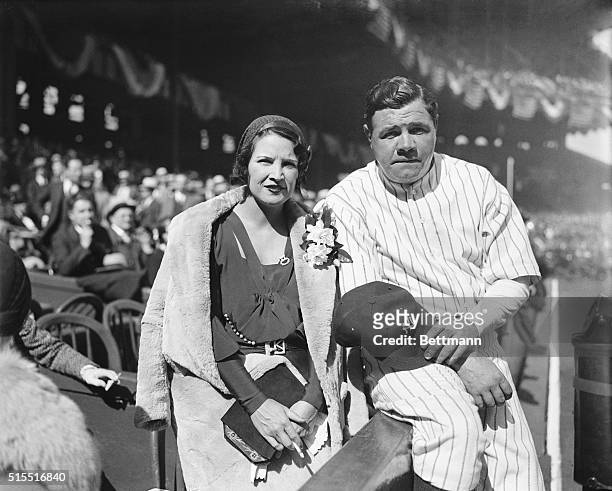 New York: At Opening Game At Yankee Stadium. Photo shows Babe Ruth and his wife as she attended the opening game, cheering with the 70,000 fans in...