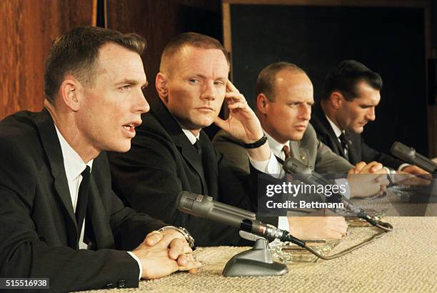 Space Center, Houston, Texas: Gemini 8 astronauts and back up crew answer questions concerning the upcoming space mission at a press conference. The...