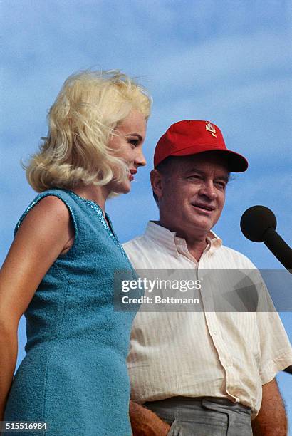 Off the coast of Vietnam: Actress Carroll Baker watches recovery of aircraft aboard the carrier USS Ticonderoga. Miss Baker is with Bob Hope's troupe...