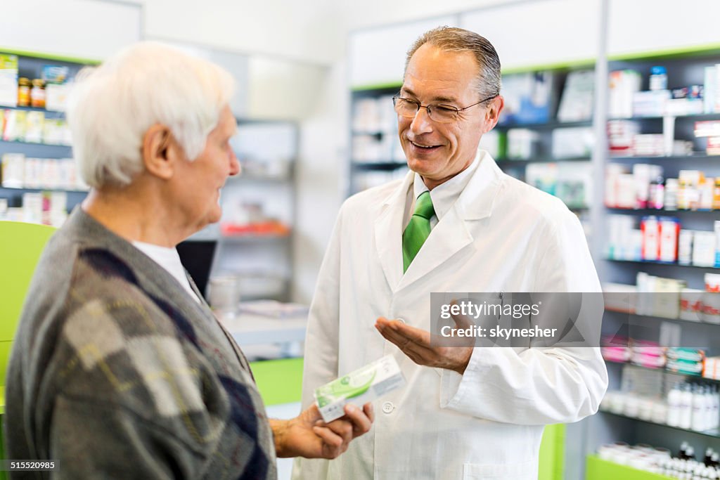 Pharmacist with a customer.