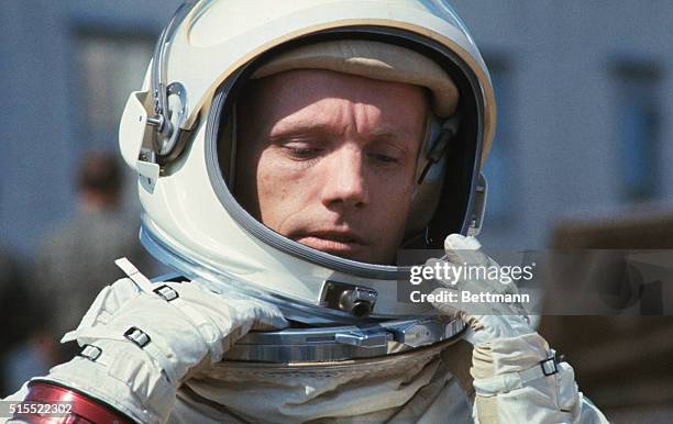 Closeup of Gemini and command pilot Neil Armstrong in his space suit, March 11, during brief break in continuing round of preparations for March 15...