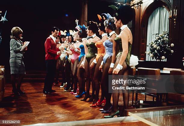 Group of Playboy Bunnies line up for inspection by Hugh Hefner, publisher of Playboy magazine, in the main room of Playboy Mansion in Chicago. Hefner...