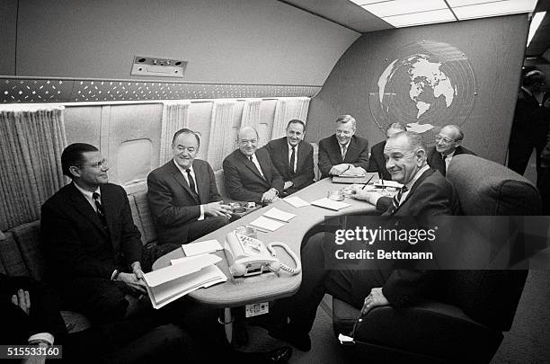 Los Angeles, CA.: President Lyndon Johnson , confers with Vice-President Hubert Humphrey & cabinet members aboard Air Force One. L-R: Robert...