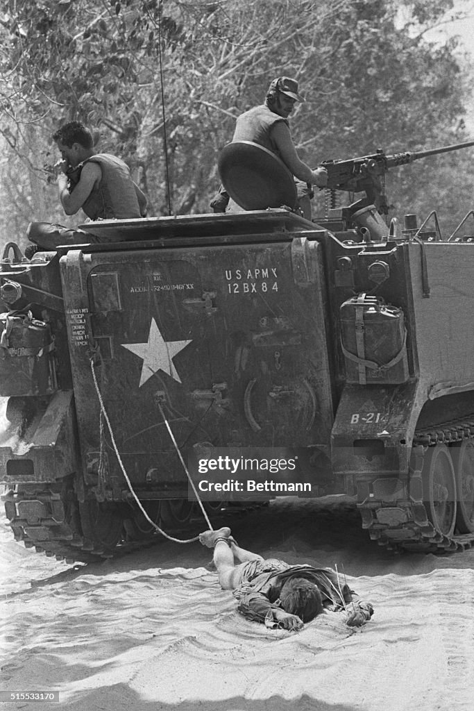 American Soldiers Dragging Body of Vietcong Soldier