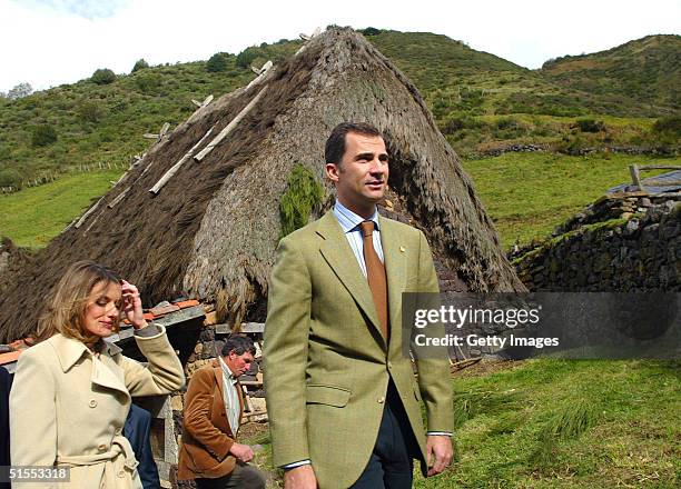 In this handout photo, Crown Prince Felipe and Princess Letizia of Spain visit the rural village of Villar de Vildas, chosen as the Best Asturian...