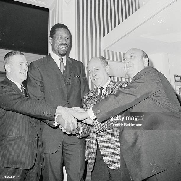 Boston: Bill Russell, the highest paid player in the history of professional basketball is all smiles after he was named the new coach of the Boston...