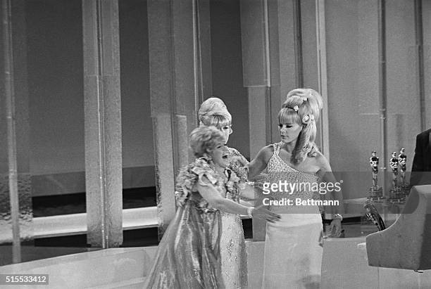 With Lana Turner standing by, Connie Stevens breaks up as Elke Sommer starts to accept an Academy Award for Julie Harris for Best Achievement in...