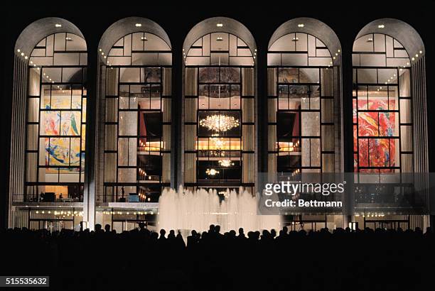This is an exterior night view of the once "new" Metropolitan Opera House in Lincoln Center on the opening night.