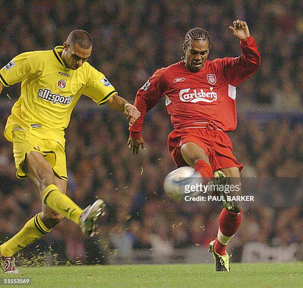 Liverpool's Florent Sinama- Pongolle and Charlton's Kevin Lisbie duel during their Premier League football match at Anfield, Liverpool, 23 October...