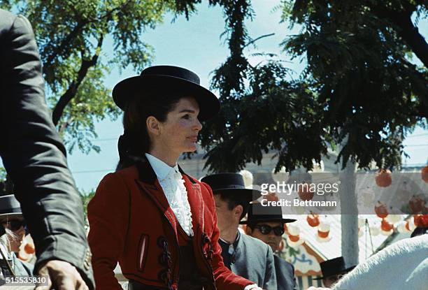closeups-of-mrs-john-f-kennedy-wearing-a-typical-andalusian-riding-outfit-rides-her-horse.jpg