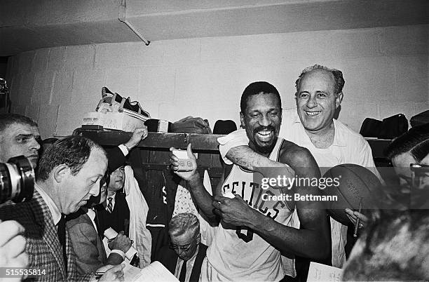 Happy twosome shown here, is Red Auerbach who coached his last Celtic's game that won their 8th straight NBA playoff championship by beating the...