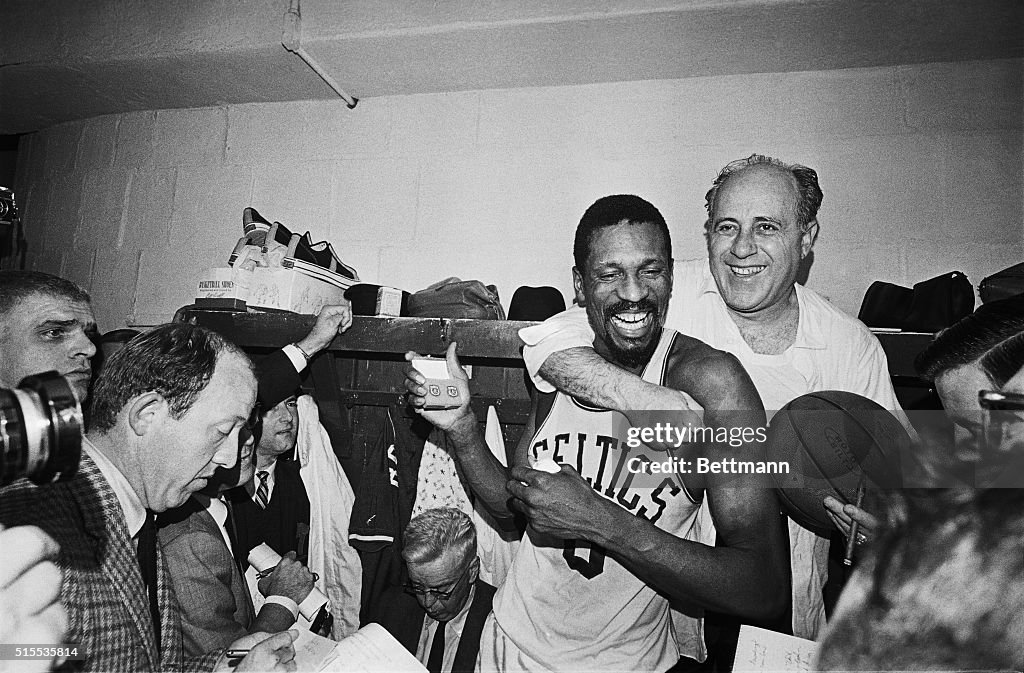 Red Auerbach Hugging Bill Russell at Press Conference