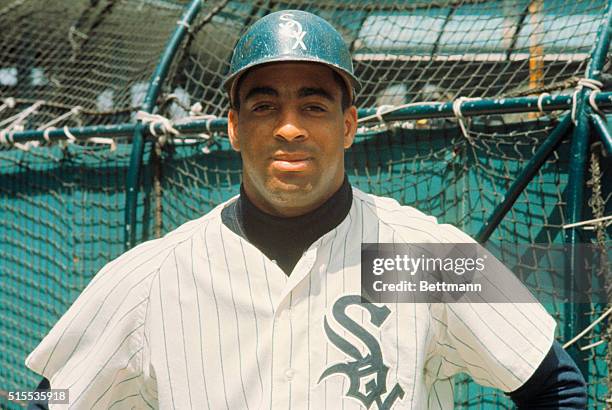 White Sox outfielder Tommie Agee stands along the batting cage at Comiskey Park.