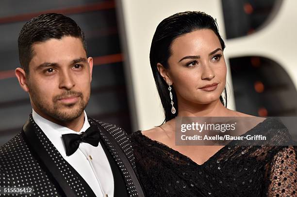 Actor Wilmer Valderrama and singer Demi Lovato arrives at the 2016 Vanity Fair Oscar Party Hosted By Graydon Carter at Wallis Annenberg Center for...