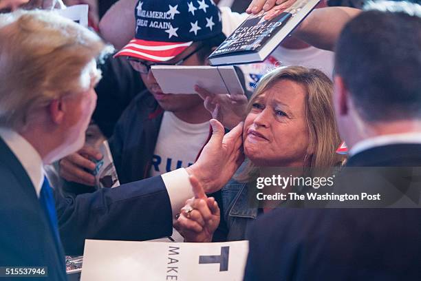 Supporter shouts to republican presidential candidate Donald Trump as he greets the crowd after speaking during a campaign event at the Savannah...