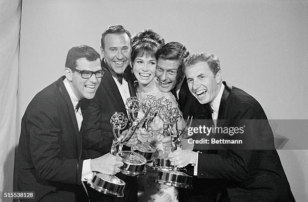 Happy group of Emmy owners get together following the 18th Annual Emmy Award Presentations here - and they all belong to the Dick Van Dyke Show, a TV...