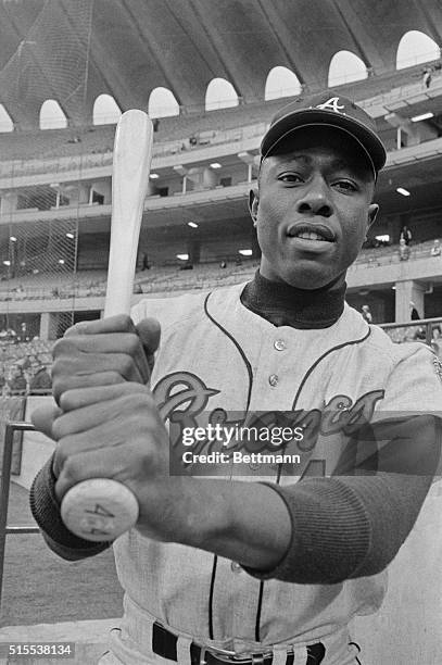 The big strong hands of Hank Aaron wield the biggest home run bat in the National League. Aaron, the rightfielder for the Atlanta Braves has hit 11...