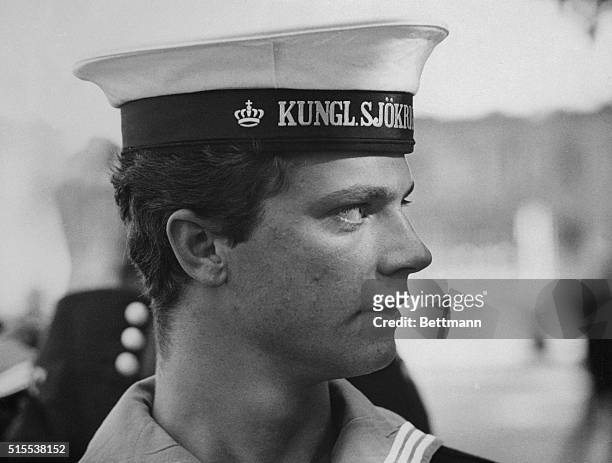 Crown Prince Carl Gustav of Sweden wears the cap of a Swedish Royal Naval Academy cadet during the Academy's open house at Naesby Park, near...