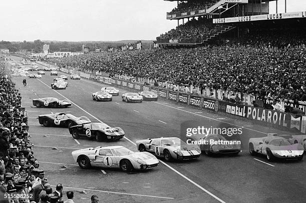 Cars in the 1966 24-hour Le Mans race move out onto the track at the start of the race June 18.