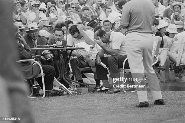 Sad Moment Augusta, Georgia: British Open champion from Buenos Aires Roberto De Vincenzo and his pairing mate, Tommy Aaron, dejectedly sit with heads...