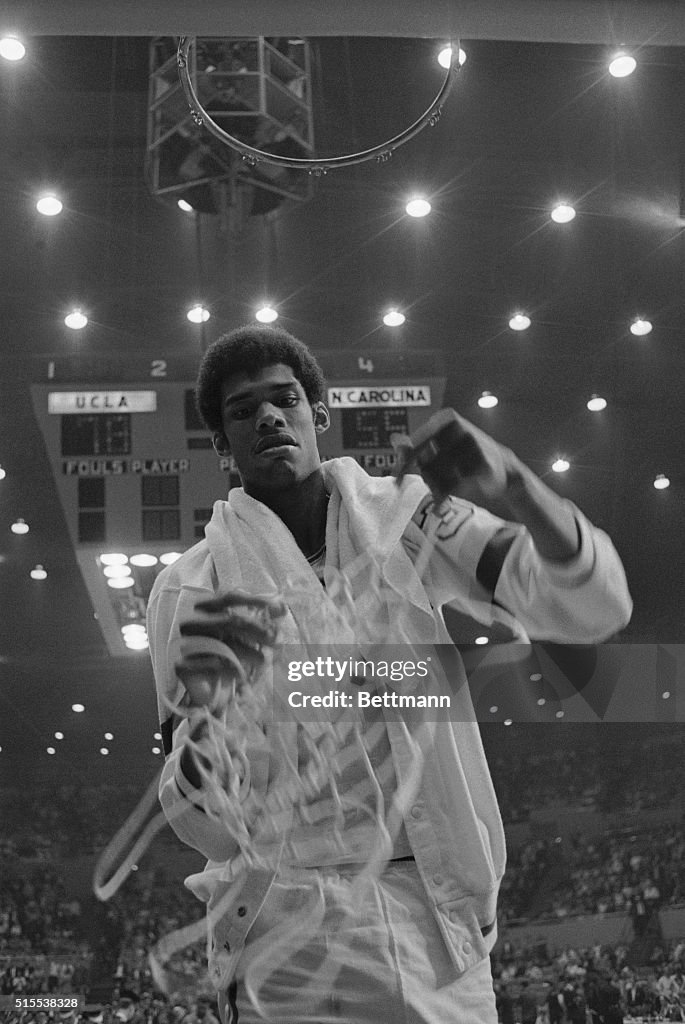 Lew Alcindor Holding Basketball Net