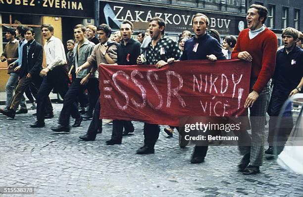 Karlovy Vary, Czechoslovakia: Czech youths with the national colors pinned to their chests demonstrate in the streets here following the Soviet...