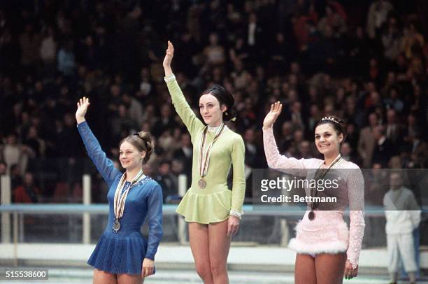 At the Winter Olympics in Grenoble, France, US Gold medalist Peggy Fleming , Gabrielle Seyfert and Hana Makova in center ice after medal ceremony,...