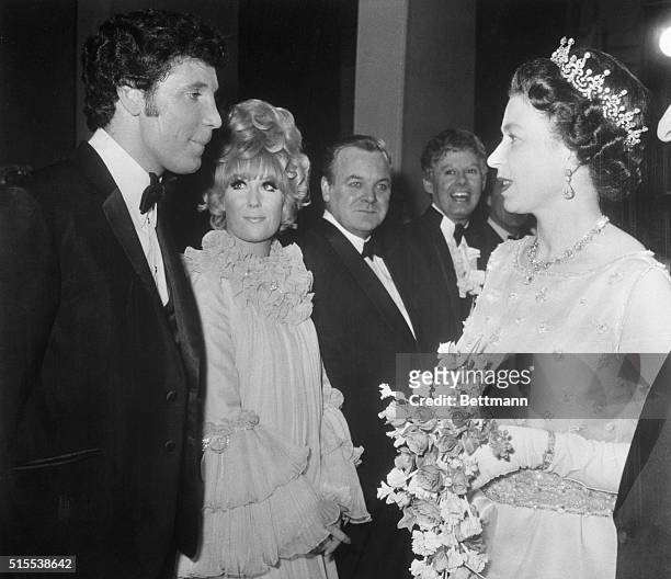Welsh born singer Tom Jones is shown here talking with her Majesty Queen Elizabeth before the special Royal Performance at the London Palladium....