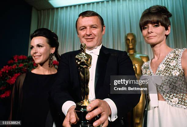 Actor Rod Steiger is hugged by his wife, Claire Bloom, after he received his Academy Award as "best actor" April 10th for his performance in "In the...