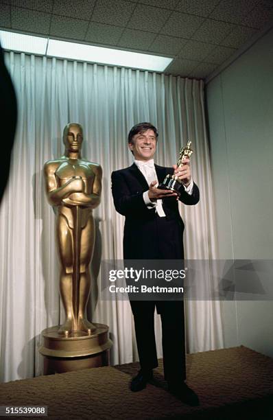 Elmer Bernstein is shown with his "Oscar" for the Best Original Music Score, at the Academy Awards presentations.
