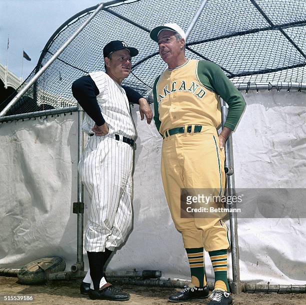 Joe DiMaggio, Oakland A's with Ralph Houk, Mgr of the New York Yankees, at Yankee Stadium prior to A's/Yankees Game.