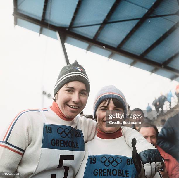 Gold medal winner of the Ladies Special Slalom, Marielle Goitschel with bronze medal winner Annie Famose of France at the 1968 Winter Olympics.