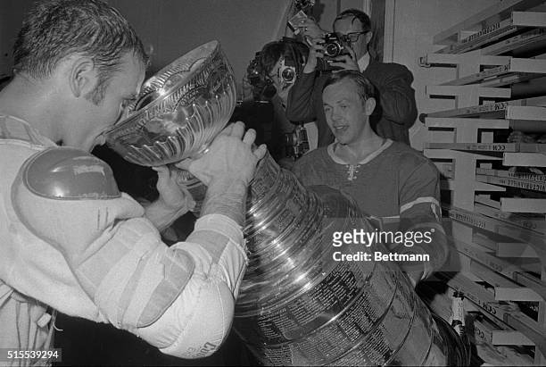 Montreal Canadiens Jacques Lemaire drinks from the Stanley Cup as teammate Yvan Cournoyer looks on. Canadiens beat the St. Louis Blues 3-2 for the...