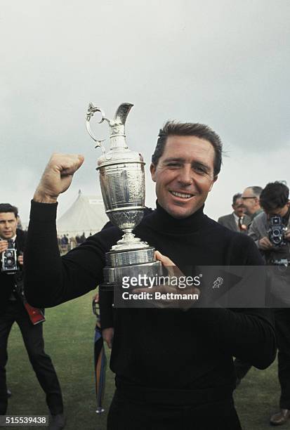 Carnoustie, Scotland: Gary Player holds the British Open Championship Cup here after finishing his fourth round of play with a tourney-winning...