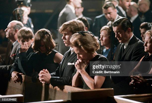 New York: Her head bowed in prayer as her husband lay in state, Mrs. Ethel Kennedy knelt with Robert Jr., Kathleen and Joseph in prayer at St....