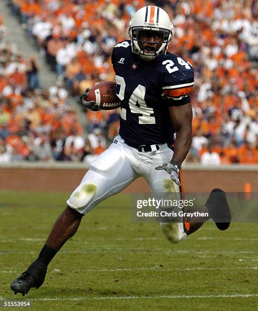 Carnell Williams of the Auburn Tigers runs for a touchdown against the Kentucky Wildcats on October 23, 2004 at Jordan-Hare stadium in Auburn,...