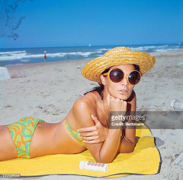 Brazilian actress Florida Bolkan, whose name has been linked by rumor with that of Richard Burton, husband of Elizabeth Taylor is shown on the beach...