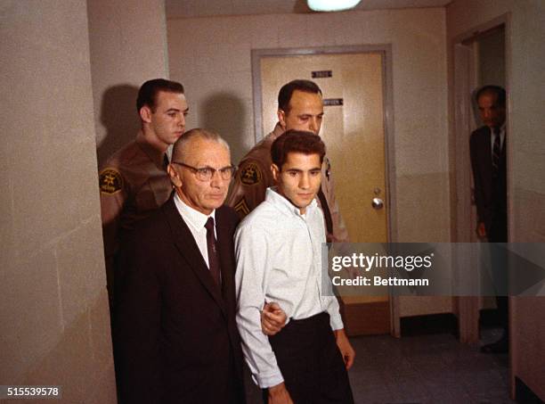 Los Angeles, Calif.: Sirhan B. Sirhan and his attorney Russell E. Parsons are photographed as they leave the courtroom following the hearing,...