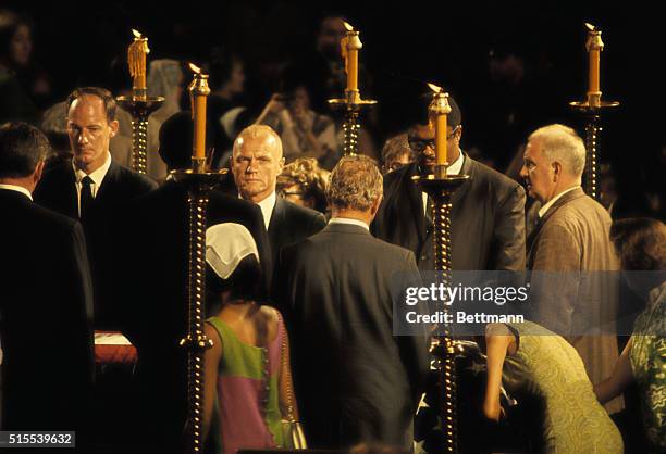 Former Astronaut John Glenn and Los Angeles Rams Lineman Roosevelt Grier form part of the Honor Guard at the casket of Sen. Robert F. Kennedy as it...